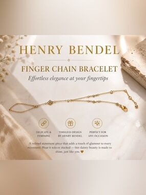 Henry Bendel gold finger chain bracelet elegant and dainty
